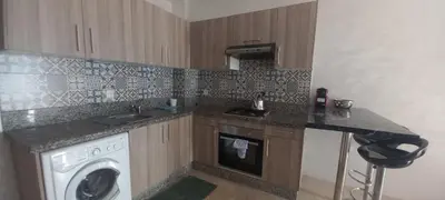 a kitchen with a washer and a washing machine at Cozy 1BR 1BA Retreat in Casablanca