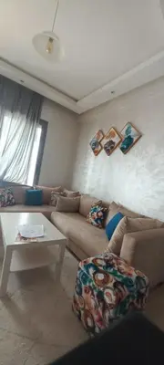 a living room with a couch and a table at Cozy 1BR 1BA Retreat in Casablanca