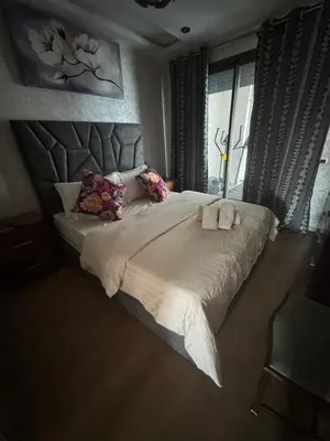 a bedroom with a large bed and a window at Appartement 3 chambres moderne a californie Casablanca in Casablanca
