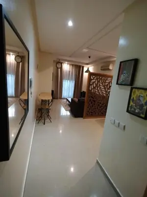 a living room with a couch and a table at Cozy 1-BR with Large Terrace in Casablanca