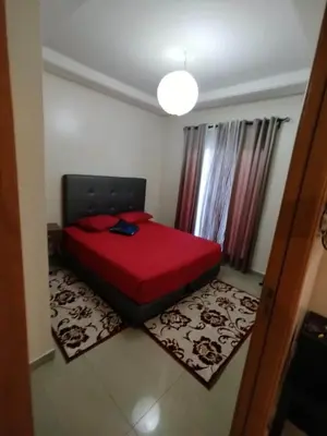 a bedroom with a red bed in a room at Cozy 1-BR with Large Terrace in Casablanca