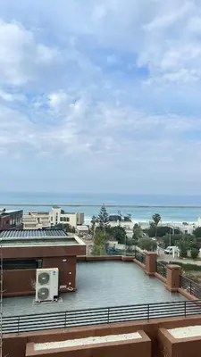 a view of the ocean from a building at Beachfront Villa in Dar Bouazza in Dar Bouazza