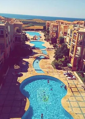 an aerial view of a resort with two water channels at Mansouria Ricoflores beach vue mer et piscine in Mansouria