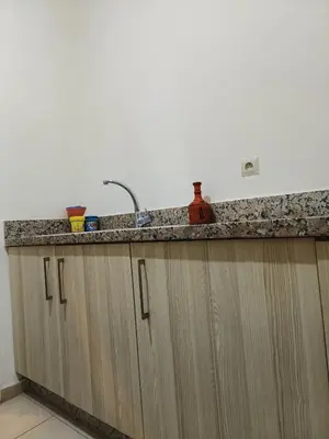 a kitchen with a sink and a counter top at Shams sidi rahal in Sidi Rahal