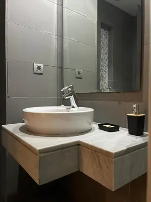 a bathroom with a sink and a mirror at Appartement luxueux prestigia in Rabat