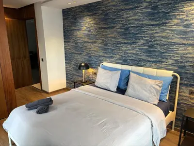 a bedroom with a large bed with a wall mural at Elegance & Comfort - Les Princesses District in Casablanca