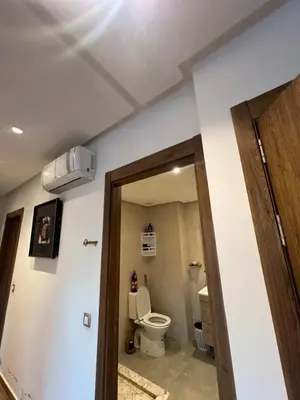 a bathroom with a toilet in a room at Blue beach Sidi Rahal in Le Polo