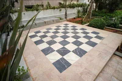 a black and white checkered floor in a garden at Ocean Pearl Luxury Stay by Sea in Casablanca