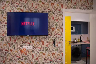 a flat screen tv on a wall in a kitchen at In the Heart of Casablanca in Casablanca