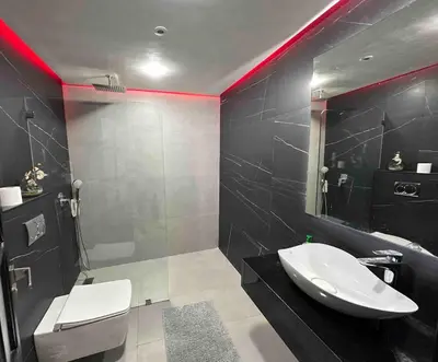 a bathroom with a white sink and a toilet at Appt Centre ville Casablanca Maarif avec Terrasse in Casablanca
