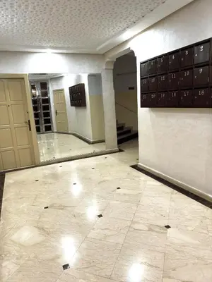 a hallway of a building with a tile floor at Emplacement idéal chambre Privée in Rabat