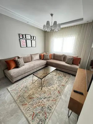 a living room with a couch and a rug at Ksar Labhar Second Nest in Rabat