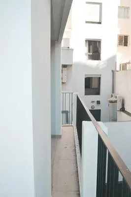 a view of a balcony of a white building at Luxueux appartement - Bourgogne, Casablanca in Casablanca