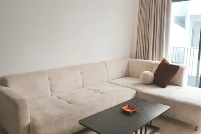 a living room with a couch and a table at Luxueux appartement - Bourgogne, Casablanca in Casablanca