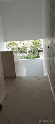 a room with a tile floor and a white wall at المنصورية in Mohammedia