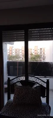 a bed in a bedroom with a view of a window at المنصورية in Mohammedia