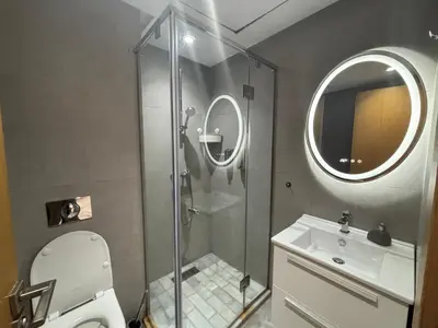 a bathroom with a shower and a toilet and a sink at Cozy studio in ain diab in Casablanca