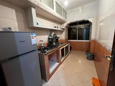 a kitchen with a refrigerator and a stove in it at Apartment busway nearshore in Casablanca