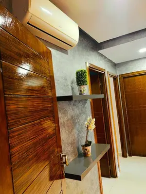 a wooden door in a room with a table at Blanca beach in Sidi Rahal