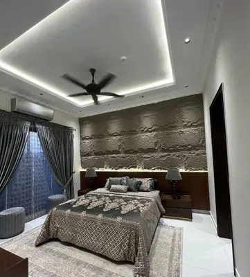 a bedroom with a bed and a ceiling fan at Villa alex33 in Casablanca