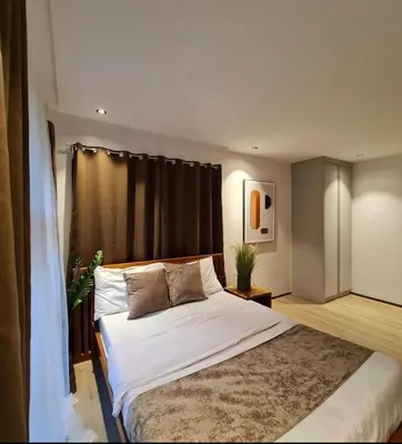 a bedroom with a large bed in a room at Villa alex33 in Casablanca