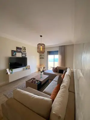 a living room with a couch and a table at La perle bleu face à la mer Rabat in Rabat