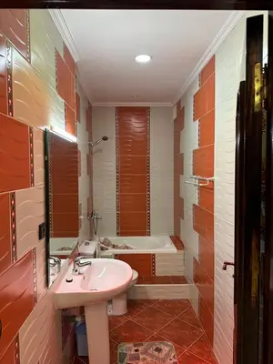 a bathroom with a sink and a bath tub at Beautiful villa Near the beach in Mohammedia