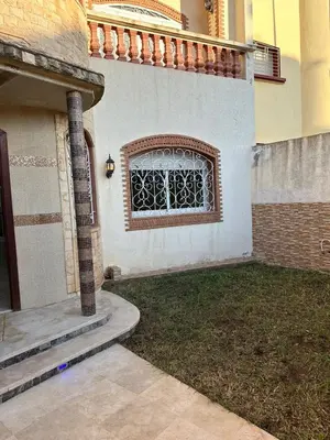 a window on the side of a house at Beautiful villa Near the beach in Mohammedia