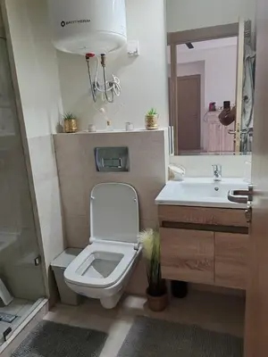 a bathroom with a toilet and a sink at Beautiful apartment in the heart of Zenata in Aïn Harrouda