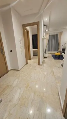a large living room with a large marble floor at Apartment with terrace - Strategic location in Casablanca