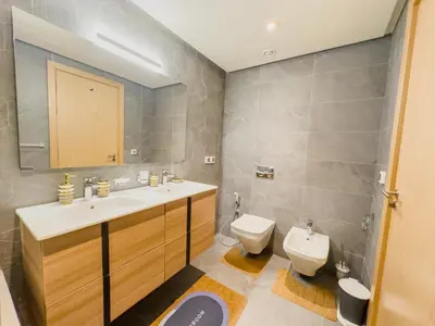a bathroom with a sink and a toilet at le carrousel Residence Rabat in Rabat