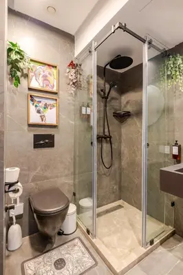 a bathroom with a shower and a toilet and a sink at VIVASTAY Casablanca - Carpdiem Aliya Residence in Casablanca
