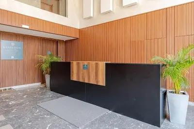 a lobby with a reception desk in a building at VIVASTAY Casablanca - Carpdiem Aliya Residence in Casablanca
