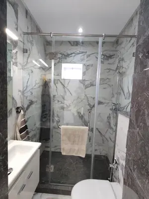 a bathroom with a shower and a toilet and a sink at Apart 3ch 2sdb salon Centre ville in Casablanca