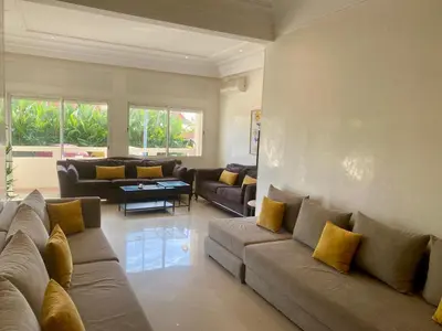 a large living room with couches and a table at Appartement Vue Panoramique sur la siesta plage WELCOME STAY in Mohammedia