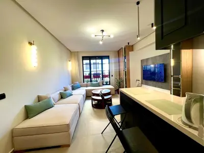 a living room with a couch and a table at Cozy apartment Casablanca in Casablanca