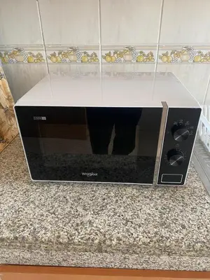 a microwave sitting on top of a counter at Quiet and spacious modern apartment near TGV station in Rabat
