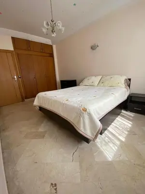 a bedroom with a large bed in a room at Quiet and spacious modern apartment near TGV station in Rabat