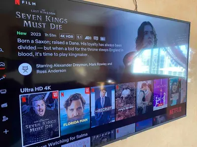 a tv screen with a bunch of movies on it at Quiet and spacious modern apartment near TGV station in Rabat