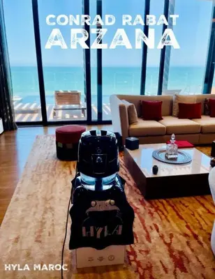 a living room with a luggage cart in the middle of a room at Luxurious space in Oulad Kerroum