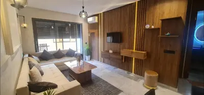 a living room with a couch and a table at SUPER HIGH 12 standing studio at Maarif in Maarif