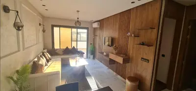 a living room with a couch and a table at SUPER HIGH 12 standing studio at Maarif in Maarif