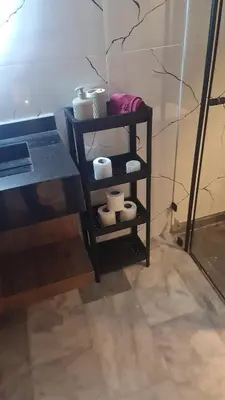 a shelf with bowls and other items on it at SUPER HIGH 12 standing studio at Maarif in Maarif