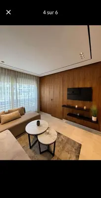 a living room with a couch and a table at SUPER HIGH 12 standing studio at Maarif in Maarif