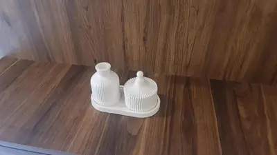 two white vases sitting on top of a wooden floor at SUPER HIGH 12 standing studio at Maarif in Maarif