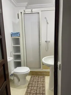 a bathroom with a toilet and a sink at Un petit studio in Settat