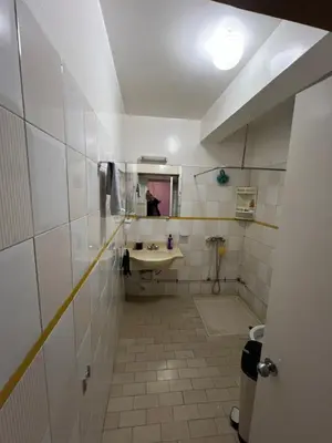 a bathroom with a sink and a mirror at Appartement Agdal in Rabat