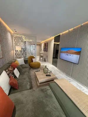 a living room with a couch and a flat screen tv at Beautiful new studio with a Seaview 8 in Casablanca