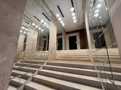 a group of stairs in a building with glass at Emplacement Central & Lumineux au Coeur De Casablanca Près Du Tramway 1 minute du Bd Abdelmoumen Maarif et 5 Minutes de Bab Marrakech et Centre Ville in Casablanca