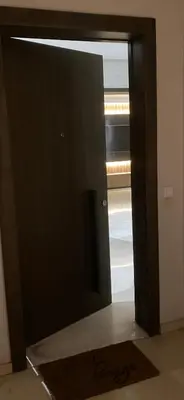 an open door with a mirror in a room at Cosy & chic appartement in Casablanca
